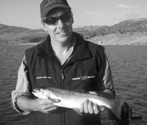 Glen Raynor with a kilo rainbow trout caught trolling a No 82 Tasmanian Devil. 
